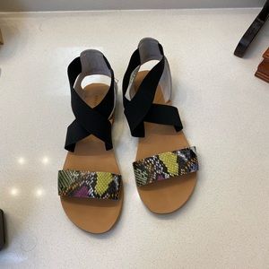 Strappy black sandals with snakeskin detail